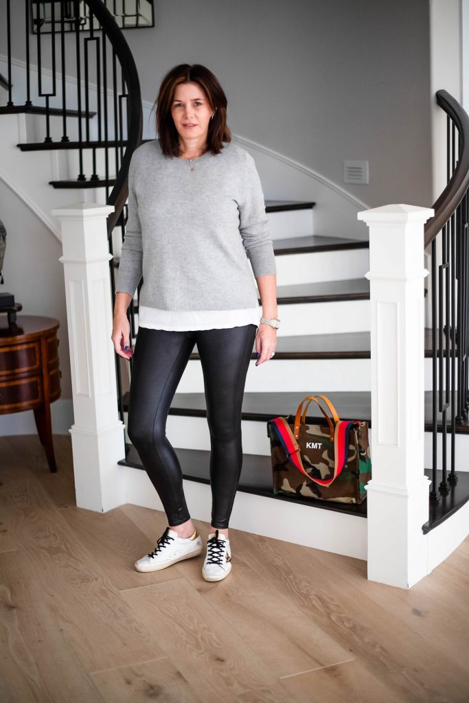 Midlife Women wearing J.Crew Cashmere crew, faux leather leggings and grey sweater