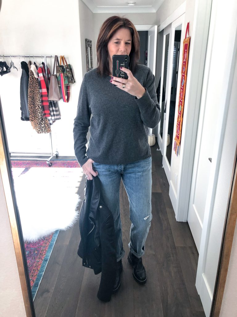 midlife women with grey sweater, rag & bone chelsea boots and leather jacket mirror selfie