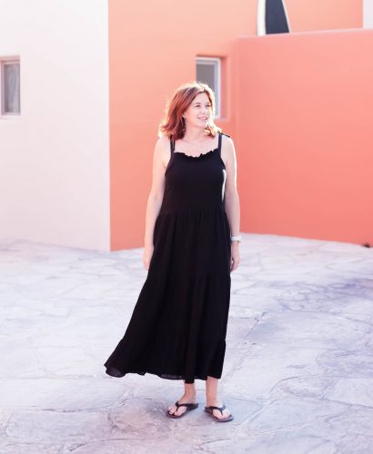 midlife women wearing Anine Bing black maxi dress and flip flops in La Paz Mexico