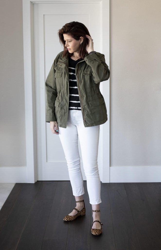 J. Crew olive green utility jacket worn over open denim shirt and