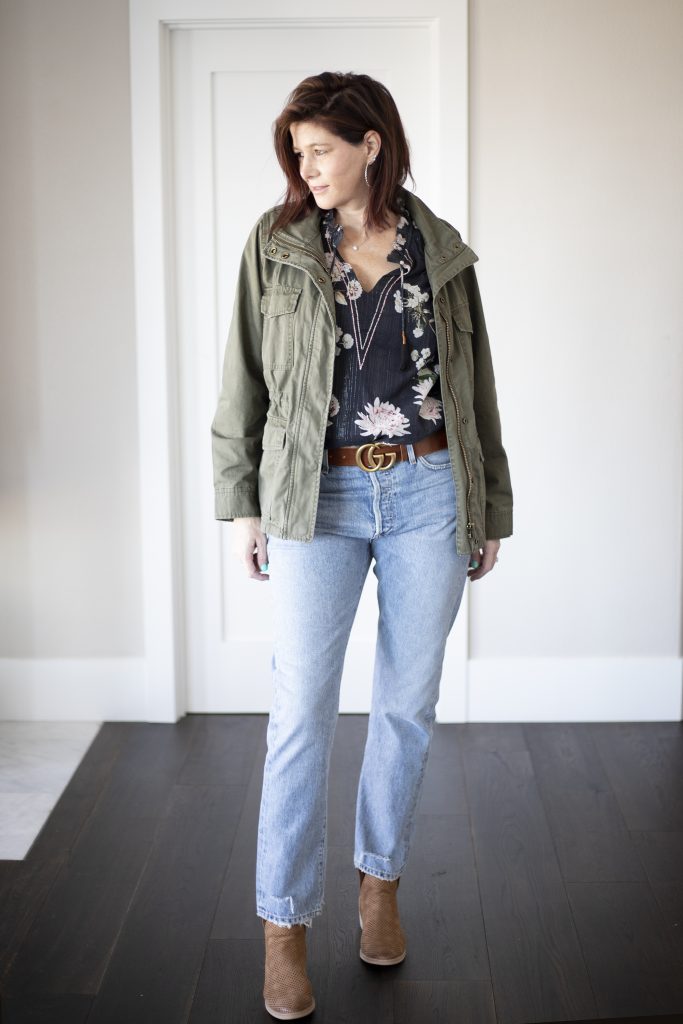 Utility jacket with floral blouse, jeans and booties