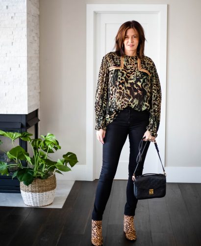 Over 50 women wearing Anthropologie boho top with black jeans