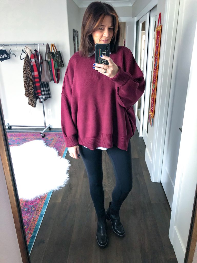 Midlife women with rag & bone chelsea boots, leggings and Free People tunic mirror selfie