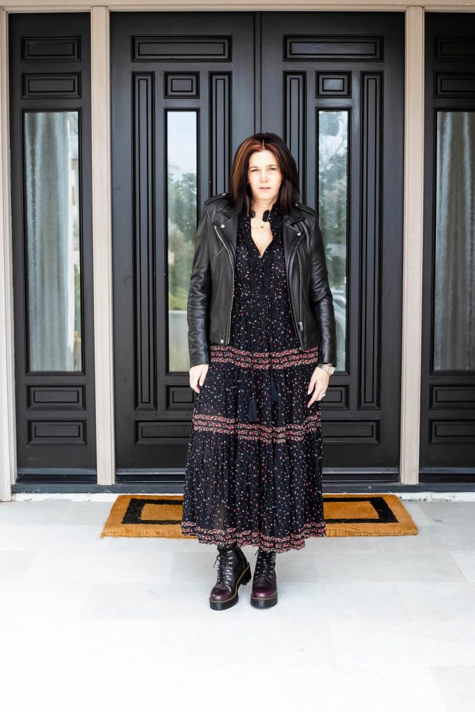 Midlife women wearing Free people maxi dress with Dr. Martens.