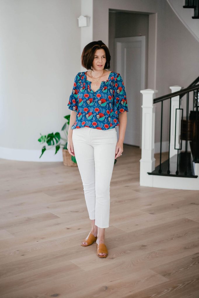 Midlife women wearing floral print top and ivory colored jeans summer update