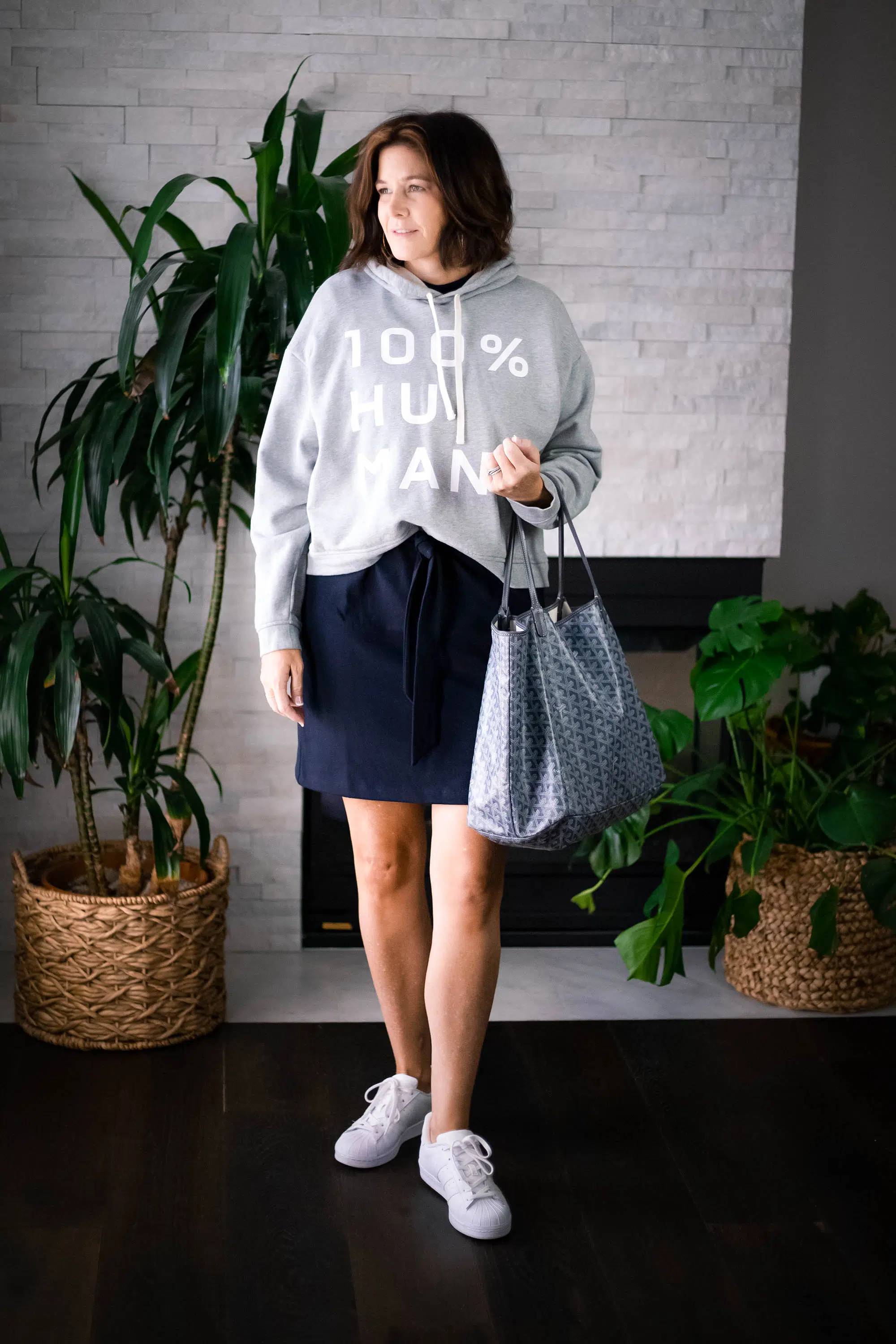 Over 50 women wearing Vince T-shirt Dress, Everlane Sweatshirt and Sneakers