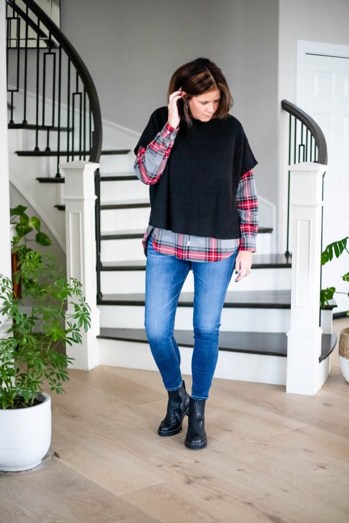 Over 50 women wearing plaid flannel shirt, sweater, jeans and boots