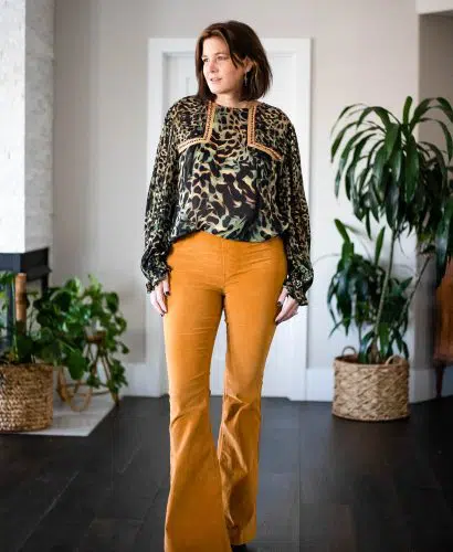 women wearing Free People corduroys and Anthro blouse