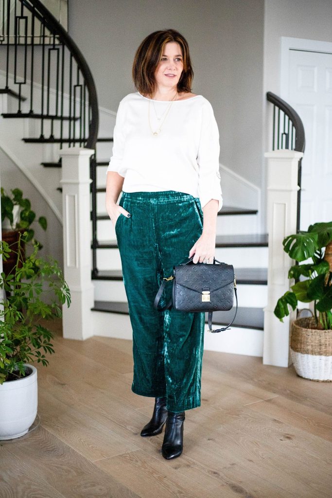 Women wearing J.Crew pull-on velvet pants with silk blouse and boots.