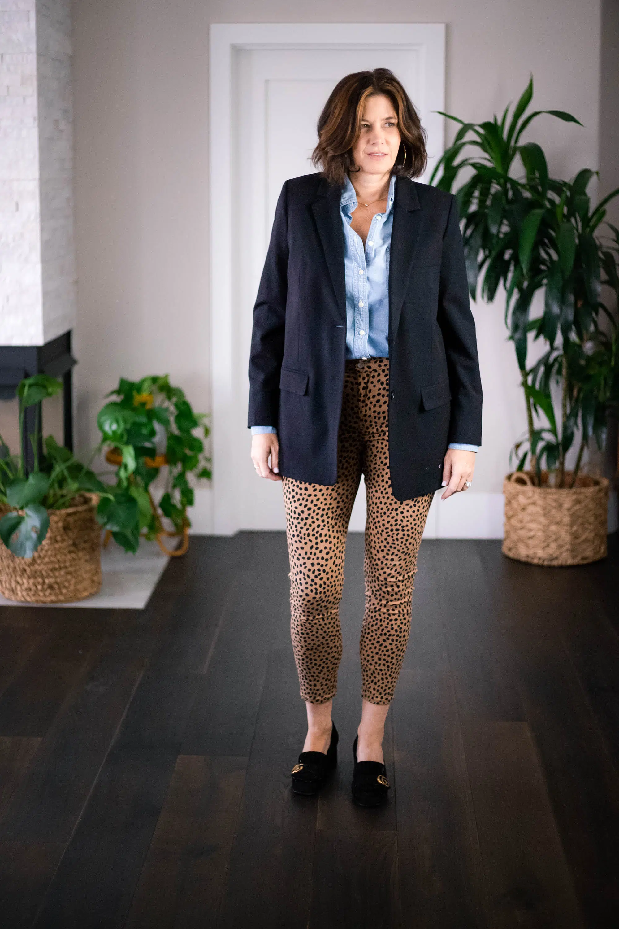 Women wearing Everlane Oversized blazer, denim shirt, leopard jeans.