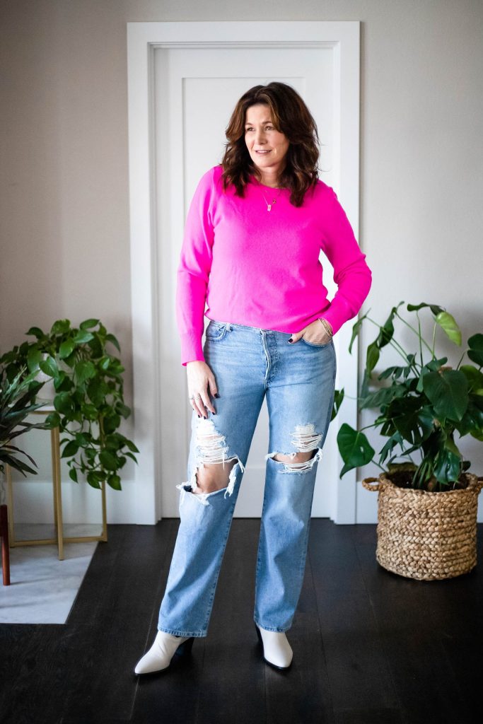 StyleDahlia wearing ripped jeans, pink cashmere sweater and boots