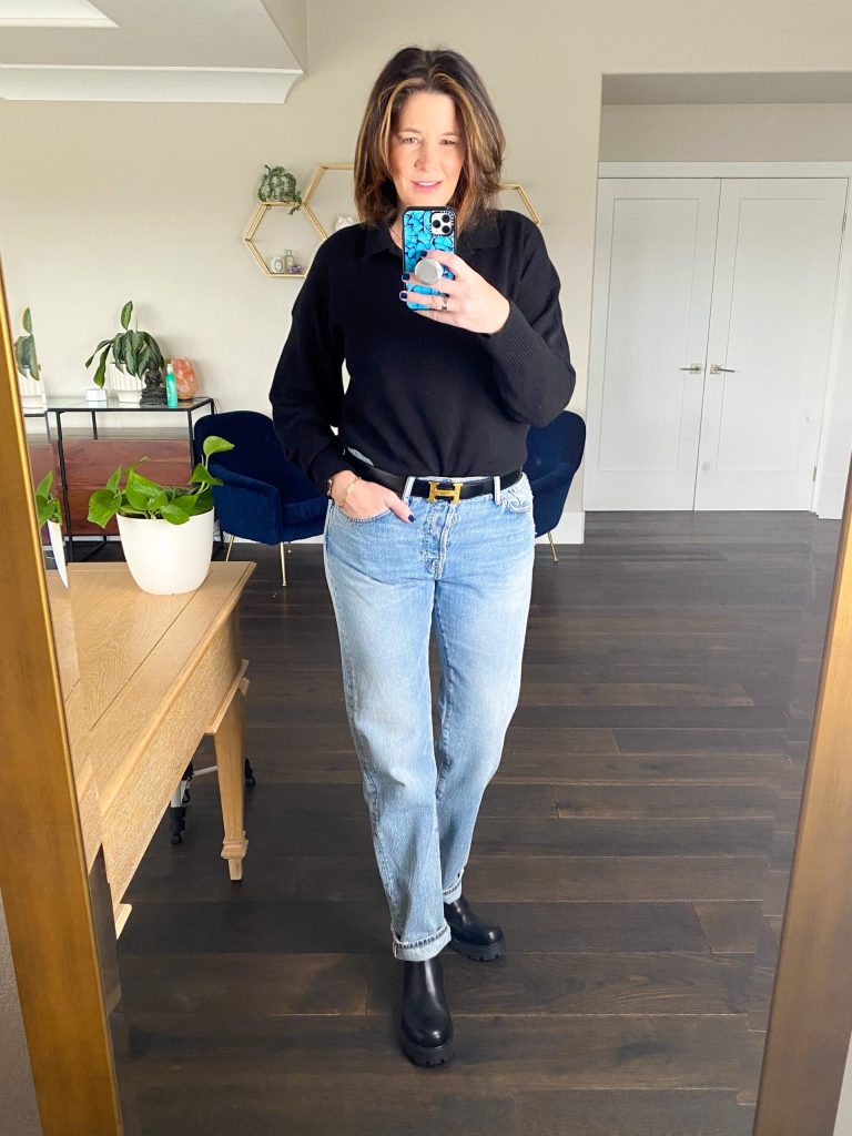 Midlife women wearing baggy jeans, Everlane collared sweater and boots.