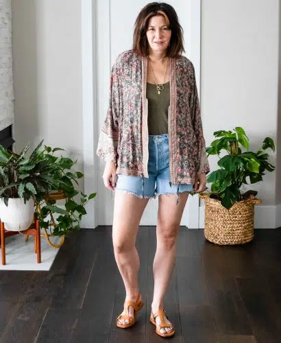 Midlife women wearing Agolde Parker Shorts, tank top and Free People Kimono