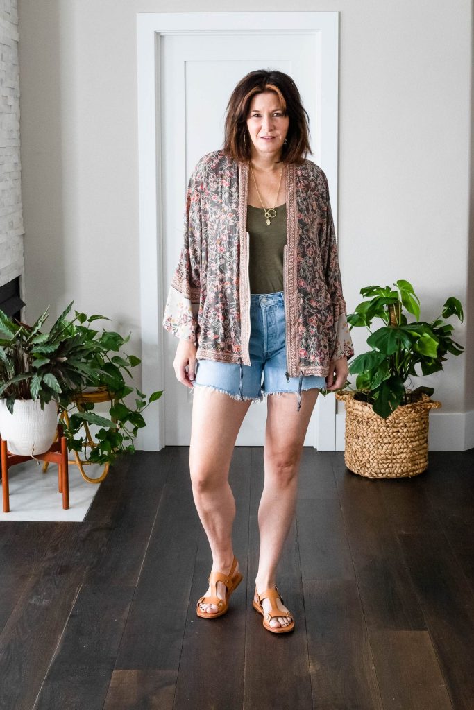 Midlife women wearing Agolde Parker Shorts, tank top and Free People Kimono