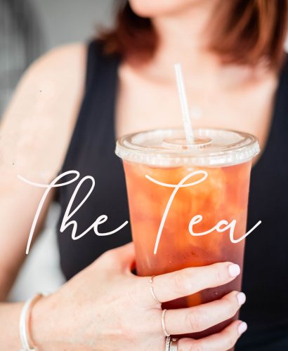 The Tea Women holding an iced tea cup