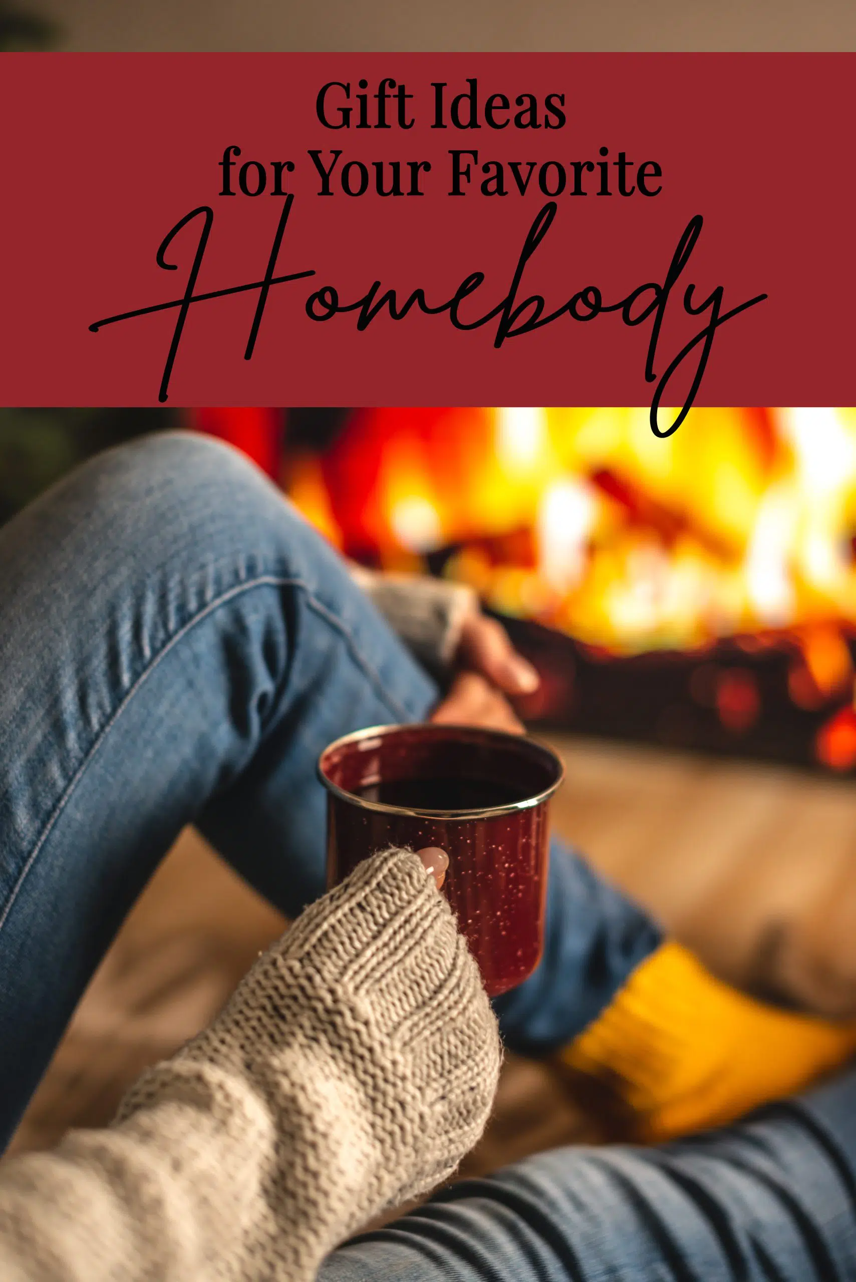 Homebody in a sweater and socks is sitting next to the fireplace with cup of beverage. Concept of creating a cozy atmosphere